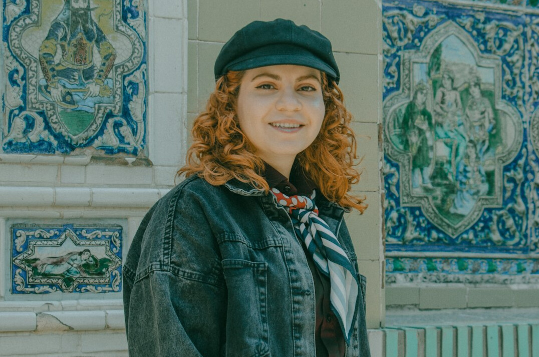 Studio portrait of a Portuguese woman investigative journalist in her thirties